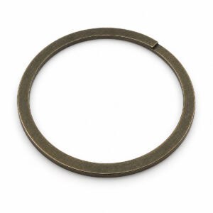 Close-up of a spiral retaining ring used in mechanical assemblies.